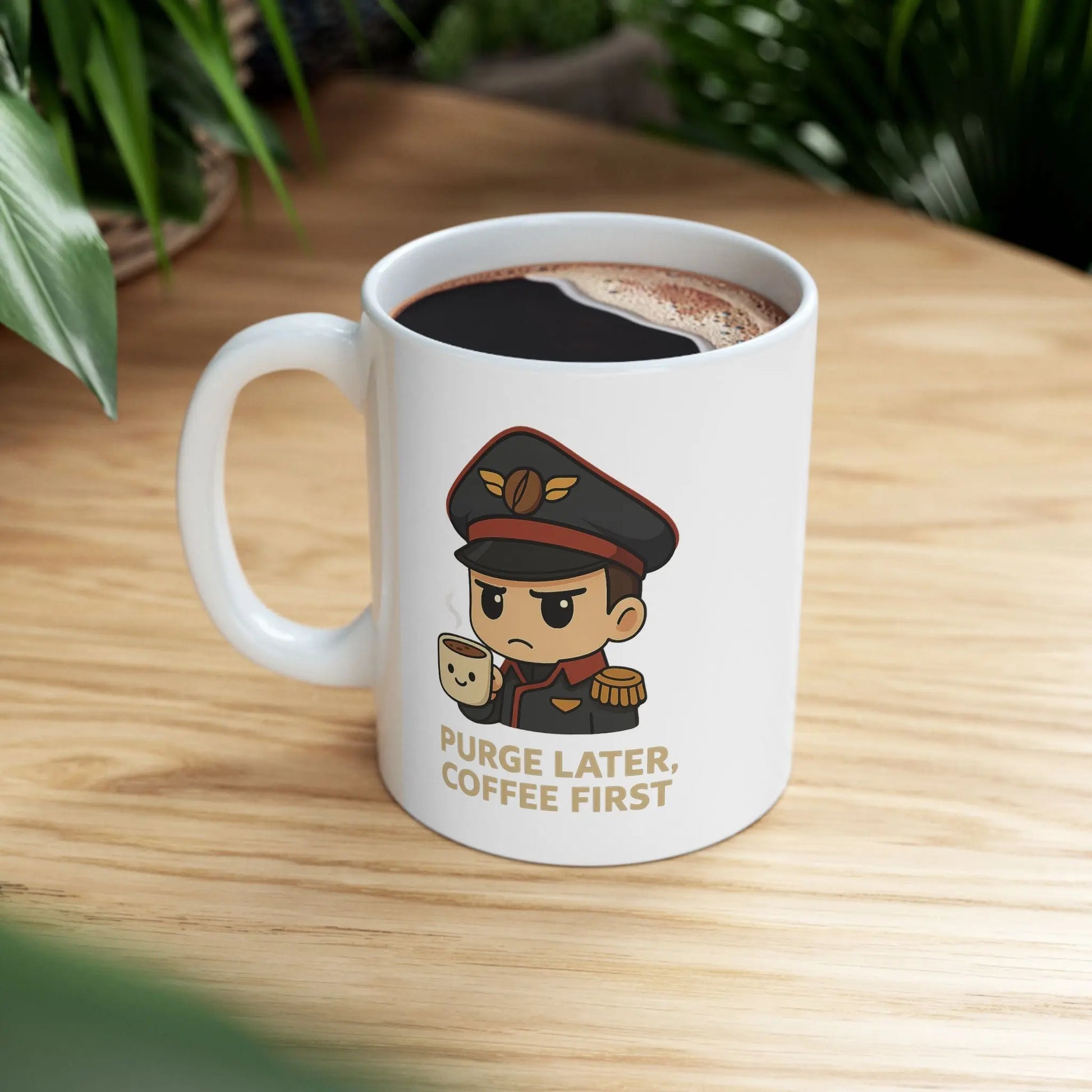 White mug with a cartoon character and text 'Purge Later, Coffee First' on a wooden table.