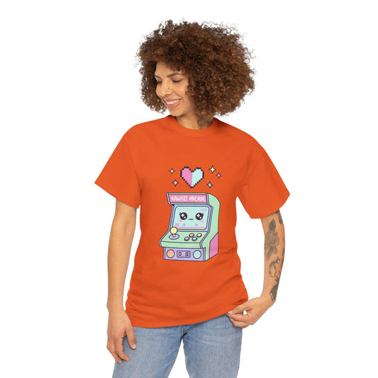 Person wearing an orange t-shirt with a pixel art arcade machine design on a white background