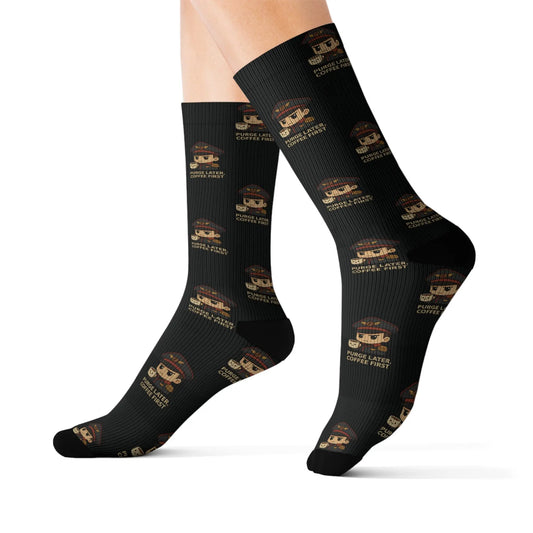 Black socks with gold patterns on a white background
