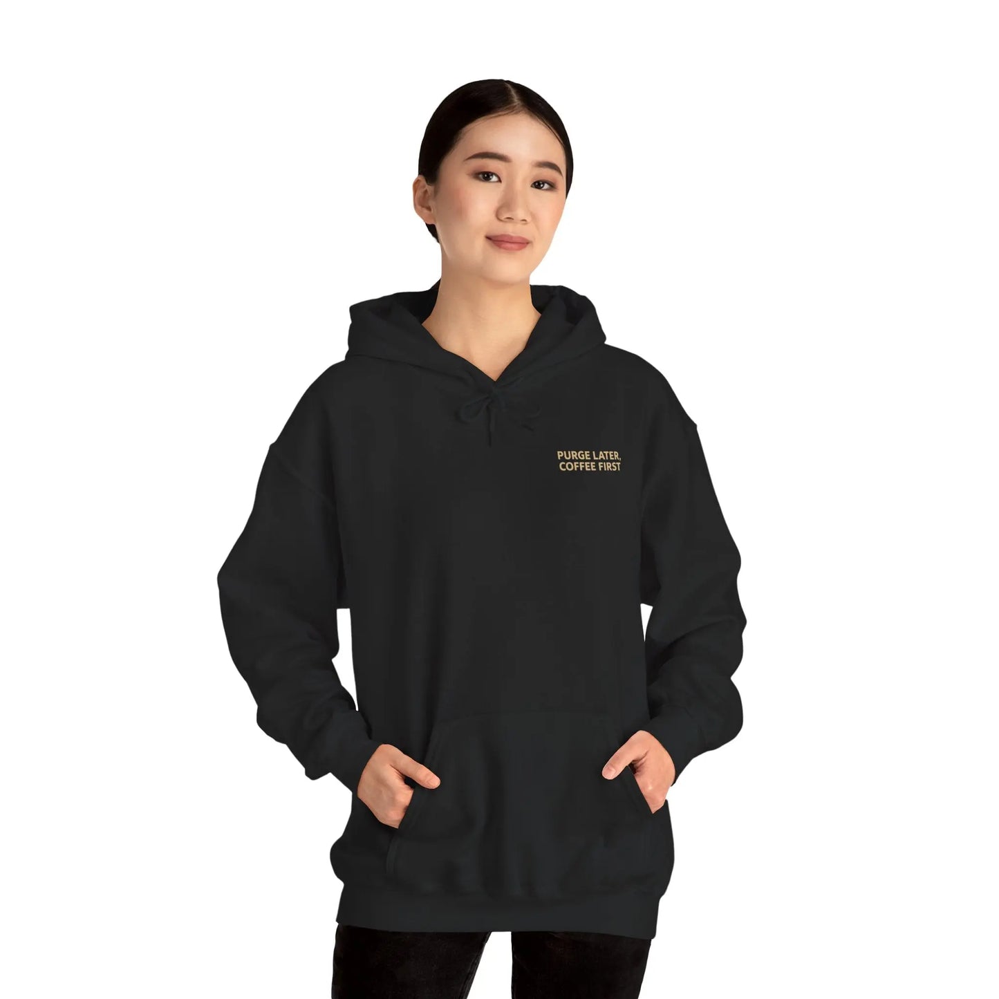 Person wearing a black hoodie with text on a white background