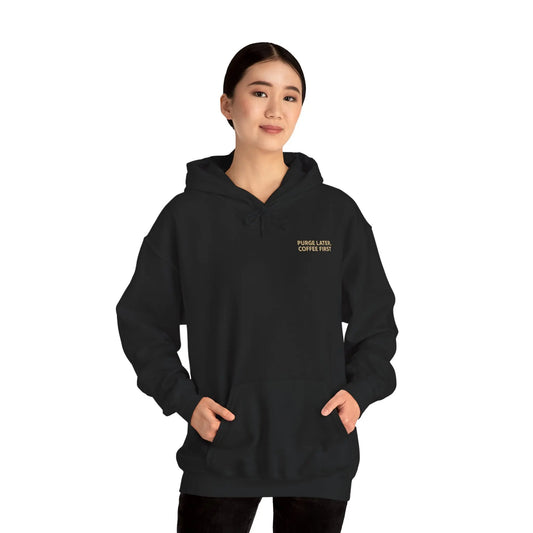 Person wearing a black hoodie with text on a white background